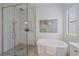 Bright bathroom showcases a large glass shower, soaking tub, and shuttered window at 328 Aria Dr, Nokomis, FL 34275