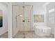 Elegant bathroom featuring a large walk-in shower and a free-standing tub at 328 Aria Dr, Nokomis, FL 34275