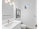 Small bathroom with white vanity and modern fixtures at 328 Aria Dr, Nokomis, FL 34275