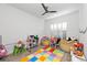 Fun playroom with colorful rug, beanbag chairs, and plenty of toys at 328 Aria Dr, Nokomis, FL 34275