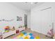 Cheerful playroom featuring a colorful floor mat and ample space for playtime at 328 Aria Dr, Nokomis, FL 34275