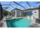 Relaxing pool and spa with covered patio and outdoor kitchen at 328 Aria Dr, Nokomis, FL 34275