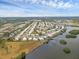 Aerial view of large waterfront community with many homes at 3608 Joyce Dr, Bradenton, FL 34208