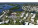 Aerial view of community with clubhouse and waterfront access at 3608 Joyce Dr, Bradenton, FL 34208