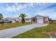 Front view of the house with driveway and landscaping at 3608 Joyce Dr, Bradenton, FL 34208