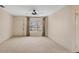 Bright living room featuring carpeted floors and a large window at 3608 Joyce Dr, Bradenton, FL 34208