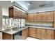 Kitchen featuring granite countertops and wooden cabinetry at 3709 Wilderness W Blvd, Parrish, FL 34219