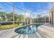 Inviting kidney-shaped pool with screened enclosure at 3832 5Th Ne Ave, Bradenton, FL 34208