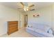 Cozy bedroom with dresser and sofa at 390 301 W Blvd # 11D, Bradenton, FL 34205