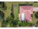 Aerial view showcasing the home's red tile roof and surrounding landscape at 395 W Rossetti Dr, Nokomis, FL 34275