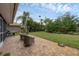 Spacious backyard patio with seating area and lush landscaping at 395 W Rossetti Dr, Nokomis, FL 34275