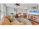 Spacious living room featuring hardwood floors and comfy seating at 395 W Rossetti Dr, Nokomis, FL 34275