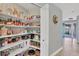 Well-organized pantry with ample shelving for storage at 395 W Rossetti Dr, Nokomis, FL 34275