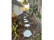 Landscaped walkway leading through garden at 395 W Rossetti Dr, Nokomis, FL 34275