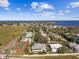 Aerial view of community with tennis court and waterfront at 4338 14Th Street Cir, Palmetto, FL 34221