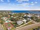 Aerial view of the house, tennis court, and waterfront at 4338 14Th Street Cir, Palmetto, FL 34221