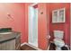 Small bathroom with shower and dark vanity at 4338 14Th Street Cir, Palmetto, FL 34221