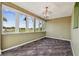 Bright dining room with large windows and a chandelier at 4338 14Th Street Cir, Palmetto, FL 34221