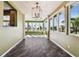 Sun-drenched dining room with tiled floors and a chandelier at 4338 14Th Street Cir, Palmetto, FL 34221