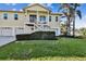 Two-story house with a double garage and manicured lawn at 4338 14Th Street Cir, Palmetto, FL 34221