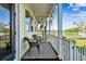 Relaxing porch with wicker chairs, overlooking a grassy area and tennis courts at 4338 14Th Street Cir, Palmetto, FL 34221