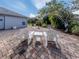 Private backyard with patio and lush landscaping at 4584 Country Manor Dr, Sarasota, FL 34233