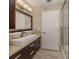 Modern bathroom with a floating sink and walk-in shower at 4584 Country Manor Dr, Sarasota, FL 34233