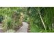 Relaxing garden path meandering through lush tropical foliage at 4584 Country Manor Dr, Sarasota, FL 34233