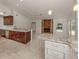 Kitchen boasts granite countertops and a wine rack at 4584 Country Manor Dr, Sarasota, FL 34233