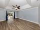 Spacious main bedroom with wood-look floors and patio access at 4584 Country Manor Dr, Sarasota, FL 34233