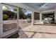 Relaxing screened porch with patio furniture and backyard access at 4584 Country Manor Dr, Sarasota, FL 34233