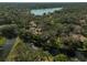 Community overview showcasing homes, lush trees, and waterways at 4655 Pine Green Trl # 24, Sarasota, FL 34241