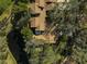 Aerial view of home showcasing roofline and surrounding trees at 4655 Pine Green Trl # 24, Sarasota, FL 34241