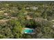 Aerial view of community pool and surrounding homes at 4655 Pine Green Trl # 24, Sarasota, FL 34241