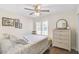 Cozy bedroom with hardwood floors and a large window at 4655 Pine Green Trl # 24, Sarasota, FL 34241