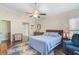 Spacious bedroom with a ceiling fan and en-suite bathroom access at 4655 Pine Green Trl # 24, Sarasota, FL 34241