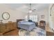 Bright bedroom with wood floors, ceiling fan, and ample closet space at 4655 Pine Green Trl # 24, Sarasota, FL 34241