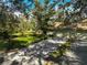 Front view of home with driveway, two-car garage, and landscaping at 4655 Pine Green Trl # 24, Sarasota, FL 34241