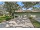 Home's exterior showcasing a two-car garage and driveway at 4655 Pine Green Trl # 24, Sarasota, FL 34241