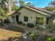 Single-story house with a one-car garage and manicured landscaping at 4655 Pine Green Trl # 24, Sarasota, FL 34241