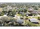 Aerial view of a residential neighborhood showcasing various homes and landscape at 480 Azalea Rd, Venice, FL 34293