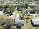 House situated on a tree-lined street in a residential area at 480 Azalea Rd, Venice, FL 34293