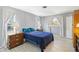 Bright bedroom with a comfortable bed and wood floors at 480 Azalea Rd, Venice, FL 34293