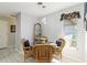 Cozy dining area with wicker chairs and a round table at 480 Azalea Rd, Venice, FL 34293