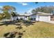 House exterior showcasing a front yard and driveway at 480 Azalea Rd, Venice, FL 34293