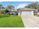 Single-story home with attached garage and well-maintained lawn at 480 Azalea Rd, Venice, FL 34293