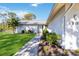 Landscaped walkway leading to the front entrance of the home at 480 Azalea Rd, Venice, FL 34293