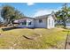 Ranch-style home with a sunroom and large yard at 480 Azalea Rd, Venice, FL 34293