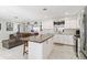 Bright kitchen with island, stainless steel appliances, and white shaker cabinets at 480 Azalea Rd, Venice, FL 34293