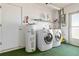 Laundry room with washer, dryer, and storage at 480 Azalea Rd, Venice, FL 34293